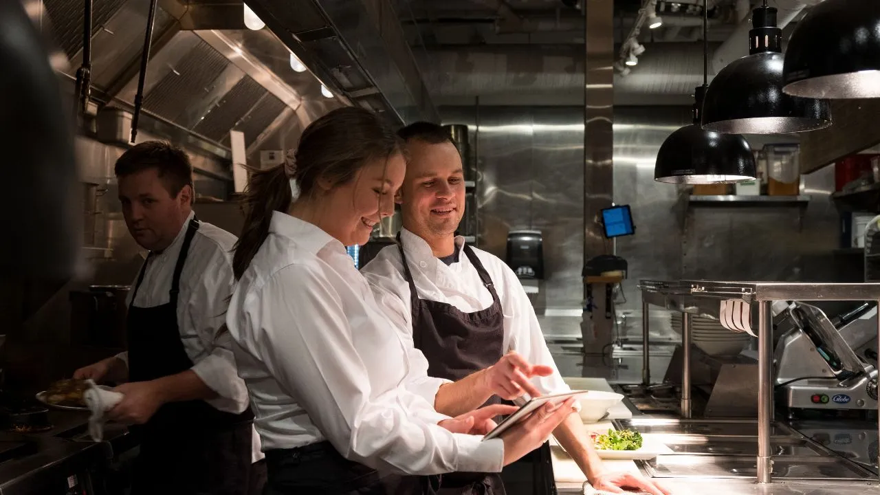 members of a culinary experts team in a professional kitchen