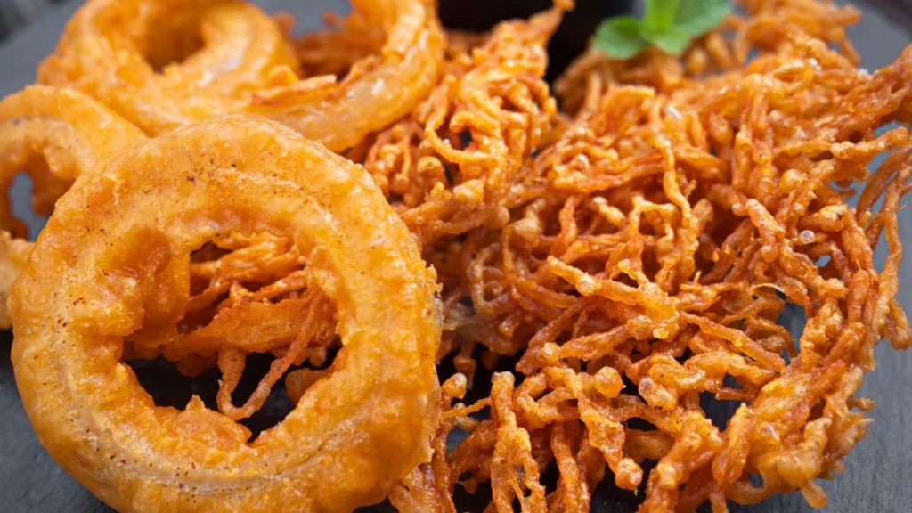 deep-fried onion rings on a plate