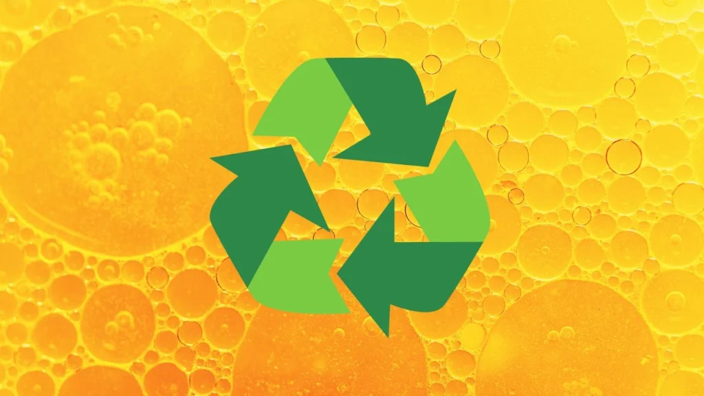closeup of oil with green recycling icon