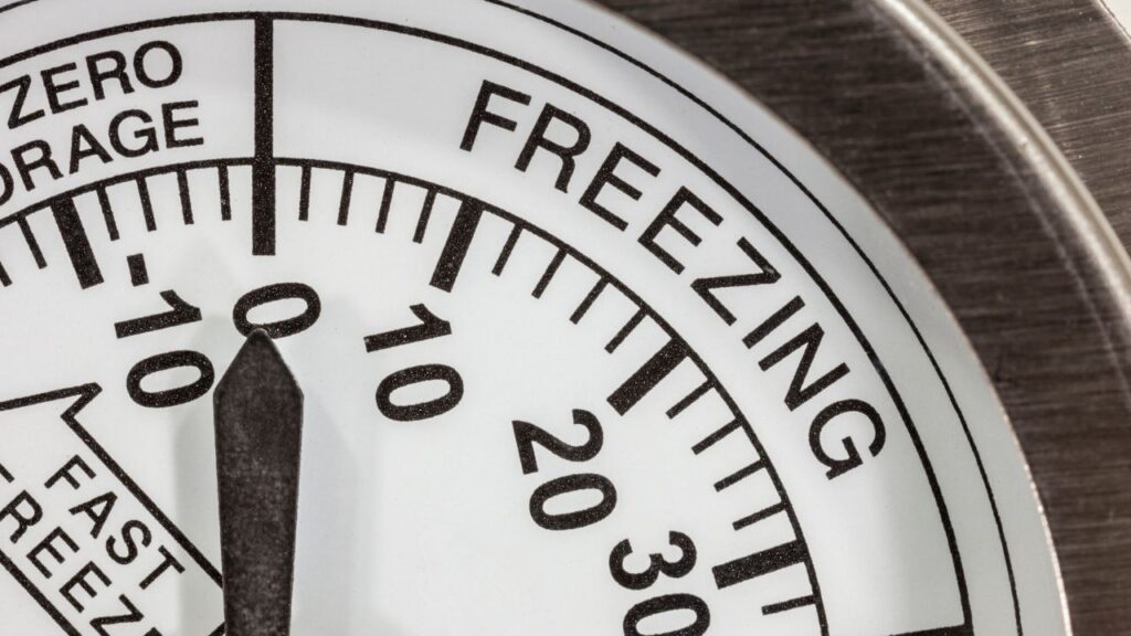 Close-up of thermometer showing freezing temperature range