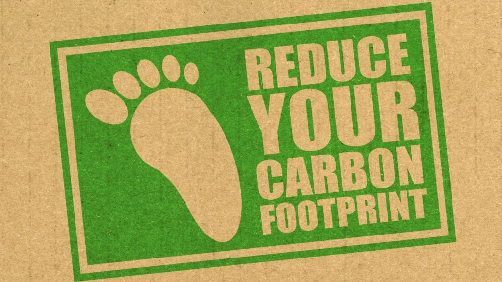 Green "Reduce Your Carbon Footprint" sustainability sign