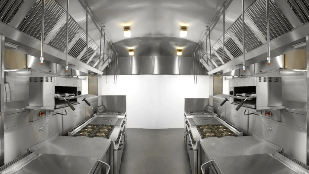 Modern stainless steel commercial kitchen with professional cooking equipment