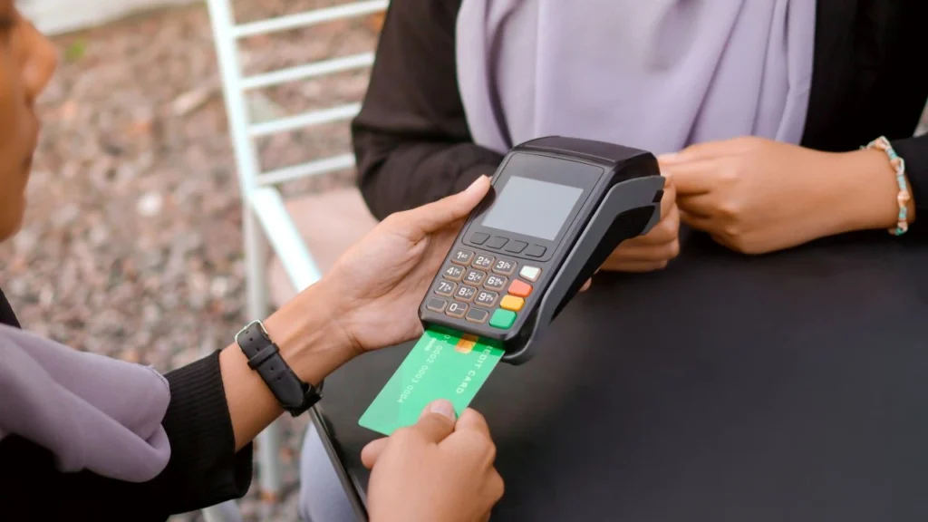 Customer using a credit card at a mobile point of sale system