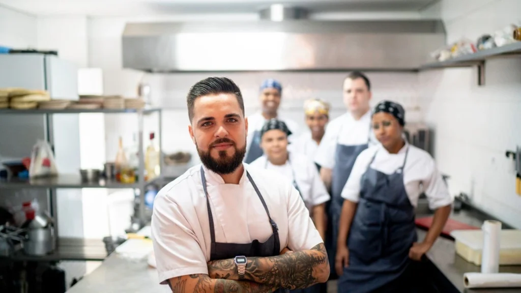 Professional kitchen staff taught best kitchen practices by experienced head chef.