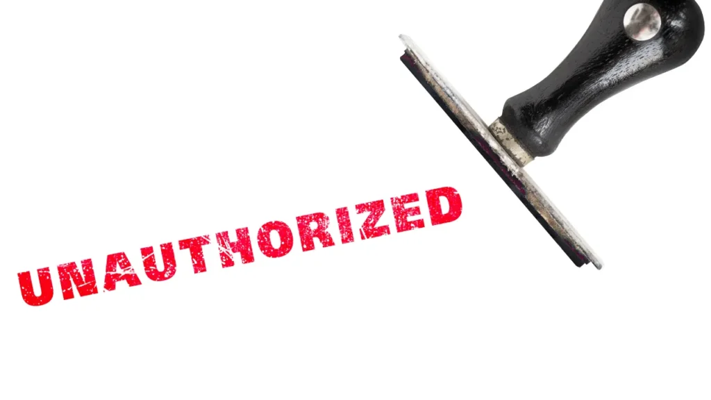 Unauthorized stamp angled with black wooden handle stamp.