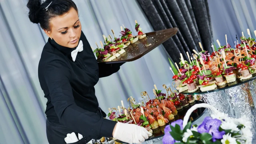 waiter serving catering table