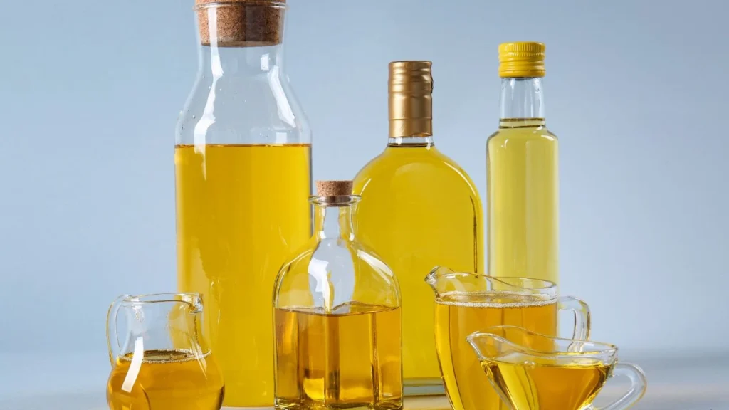 composition with cooking oil on light background