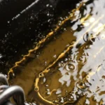 Frying oil in a fryer with bubbles and darkening signs