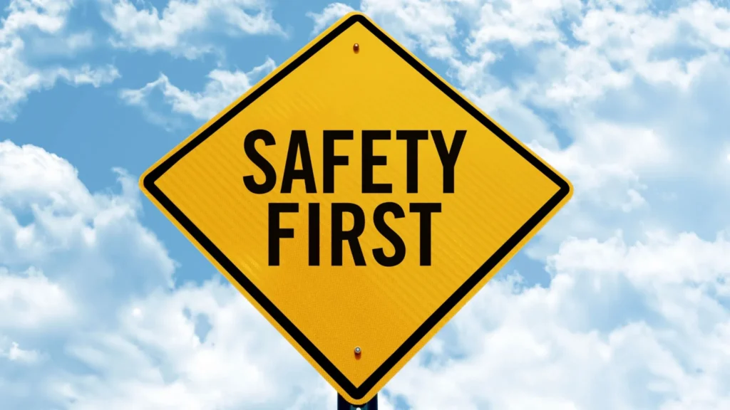 Safety first traffic sign with a blue and white sky in the background