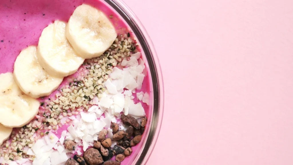Colorful smoothie bowl showcases nutritious menu options for diners.