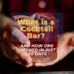 what is a cocktail bar: handing holding a drink