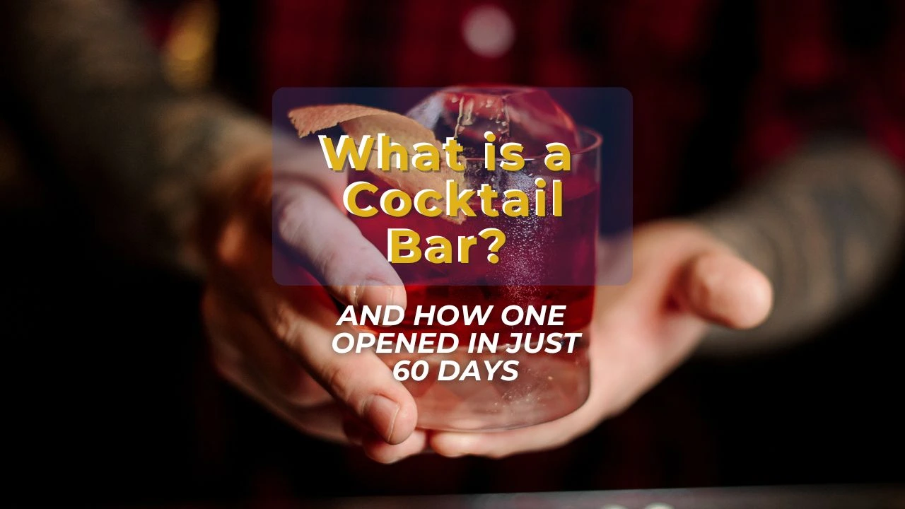 what is a cocktail bar: handing holding a drink