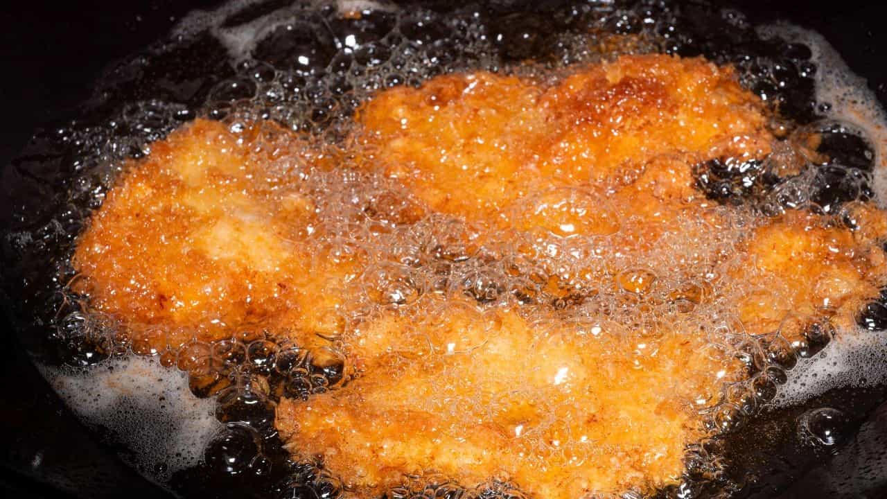 food frying in skillet full of oil