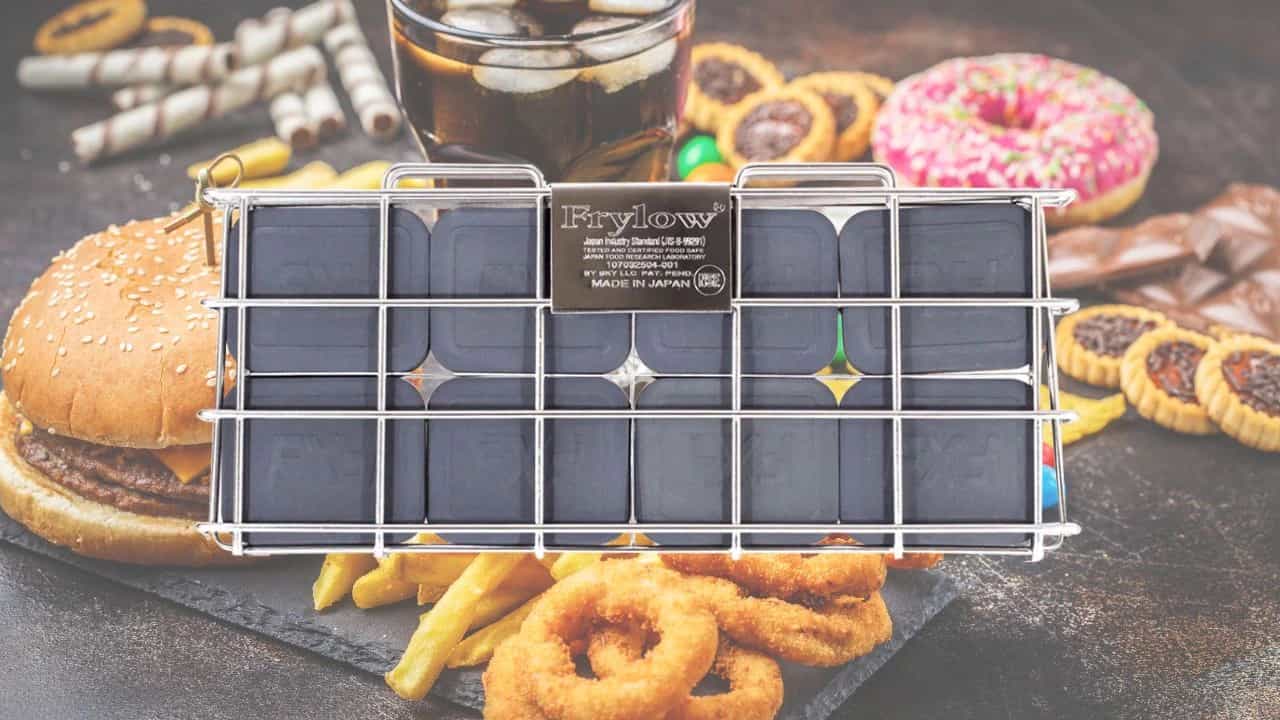 Frylow unit with a background of fried foods and a drink.