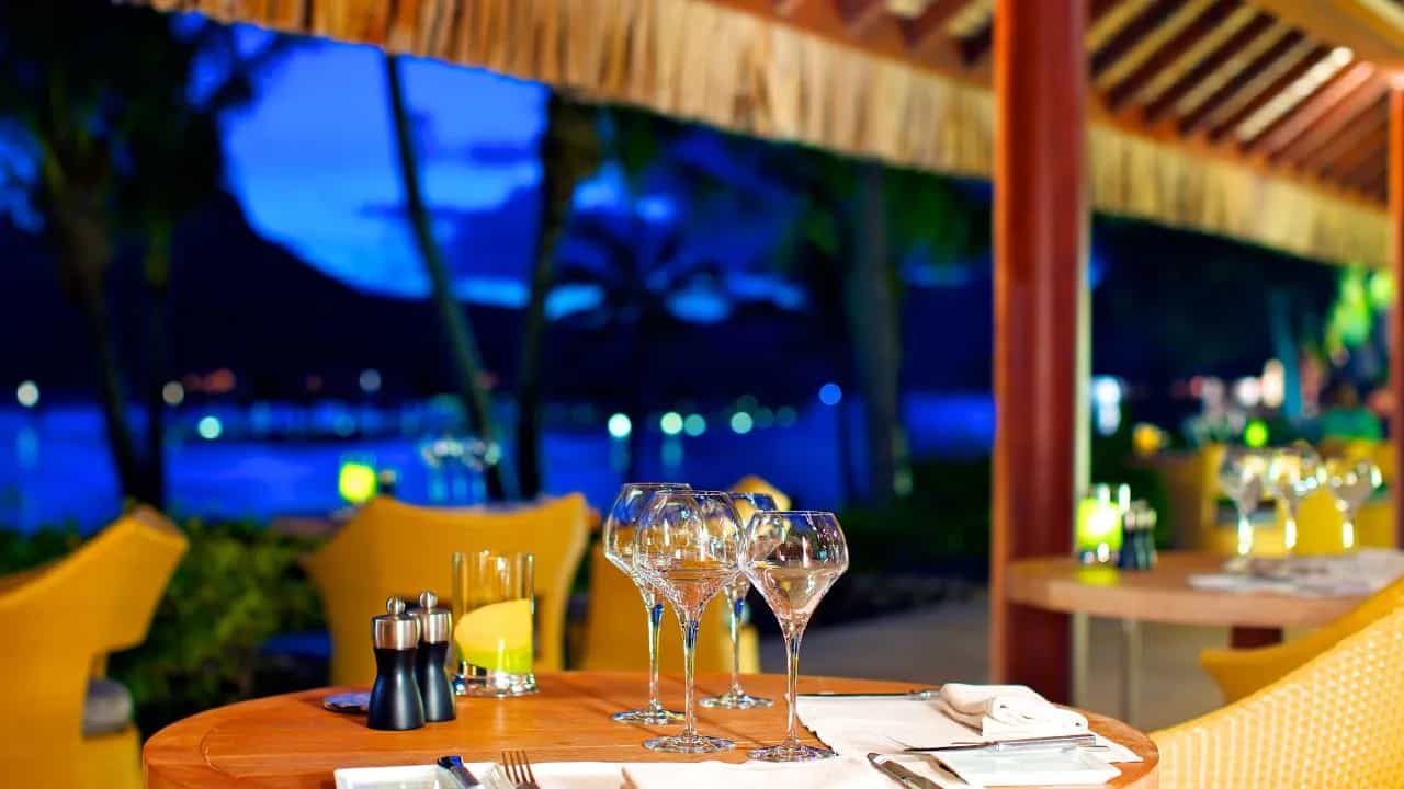 Elegant outdoor restaurant dining setup with wine glasses